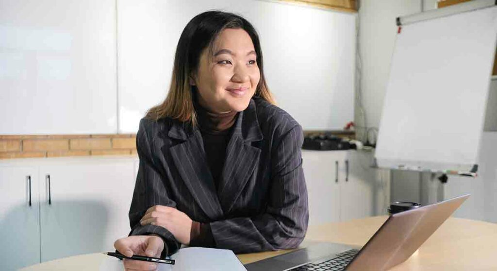 An interpreter smiles as they think about their future as a contractor with CLI.